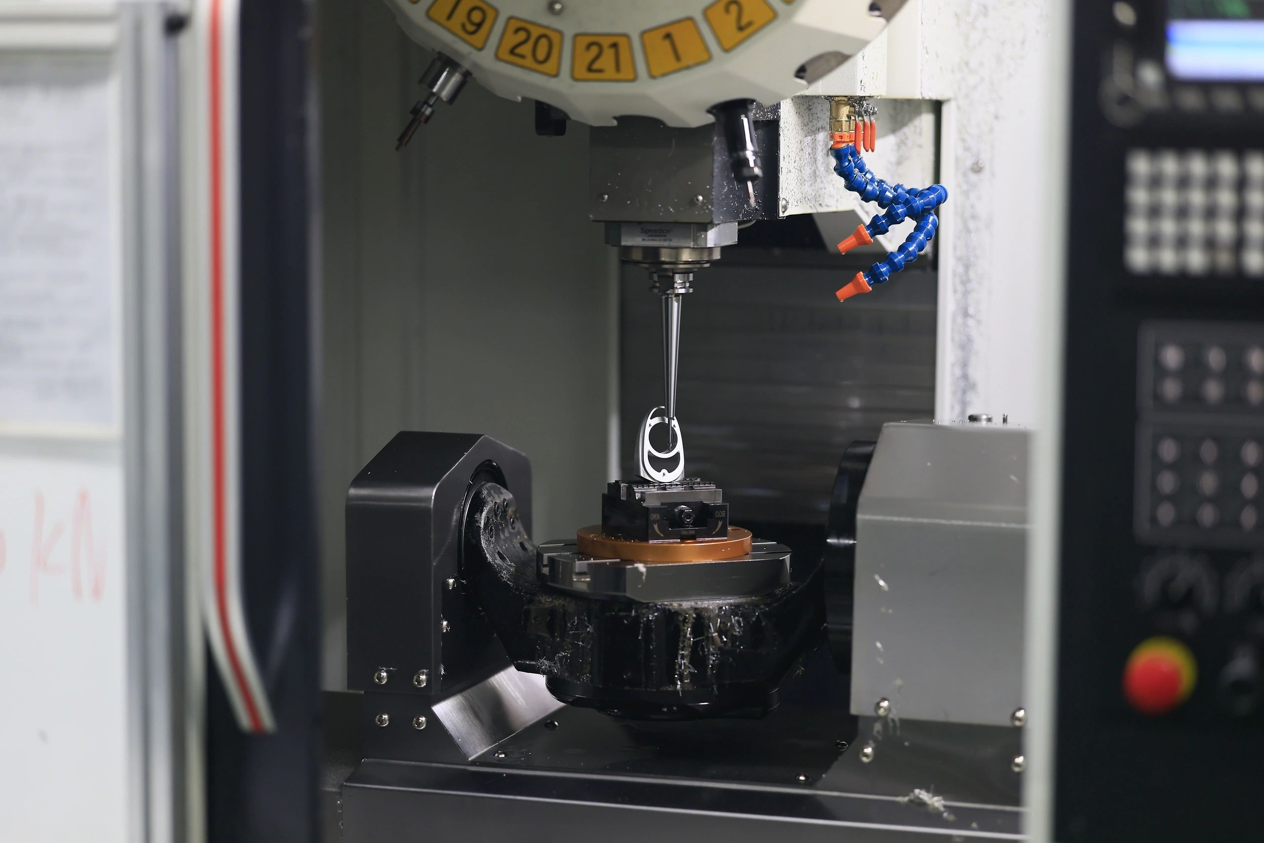 5-axis CNC machining of a precision aluminium component on a trunnion table