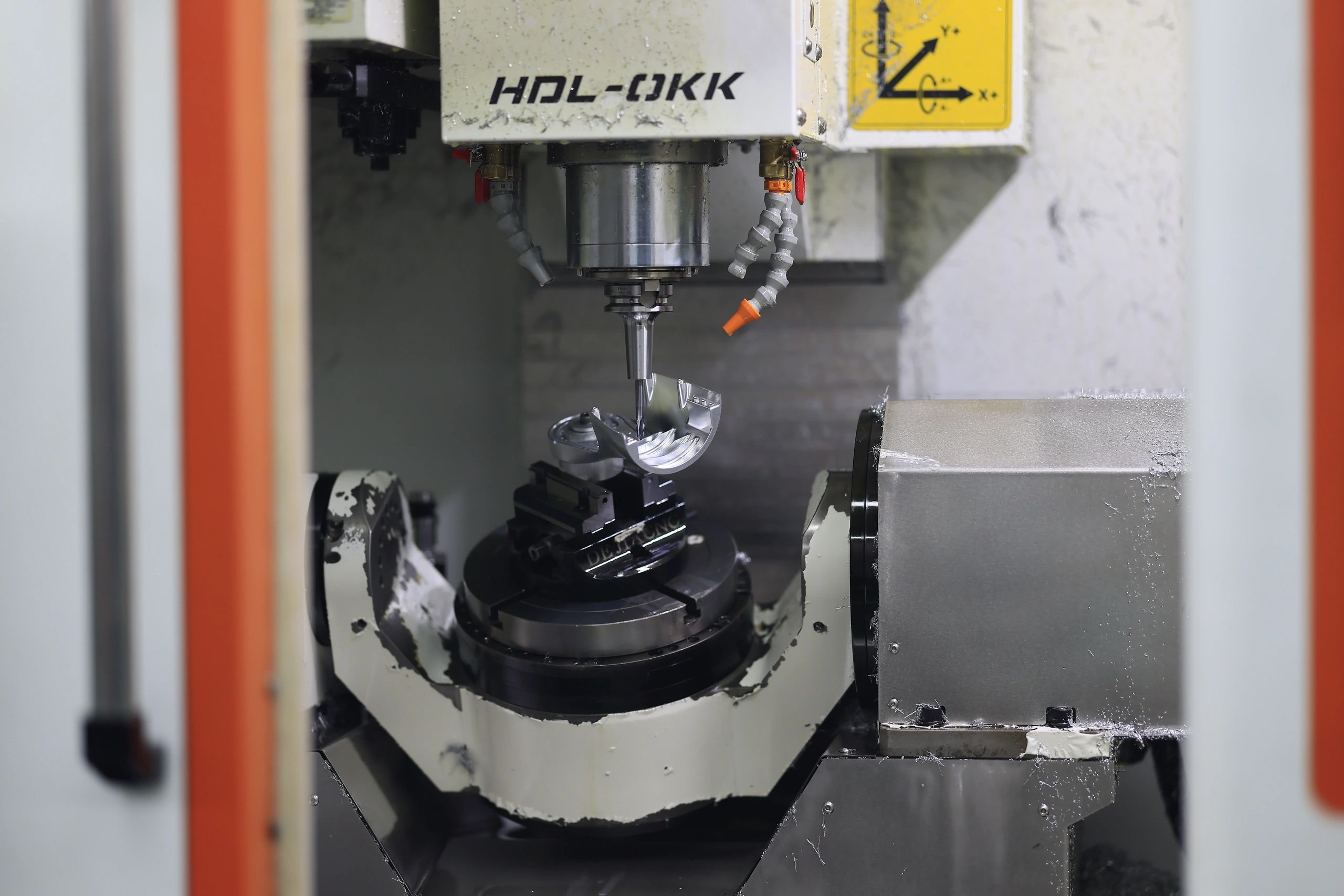 5-axis machined 6061 aluminium robot arm component in a 3-jaw chuck